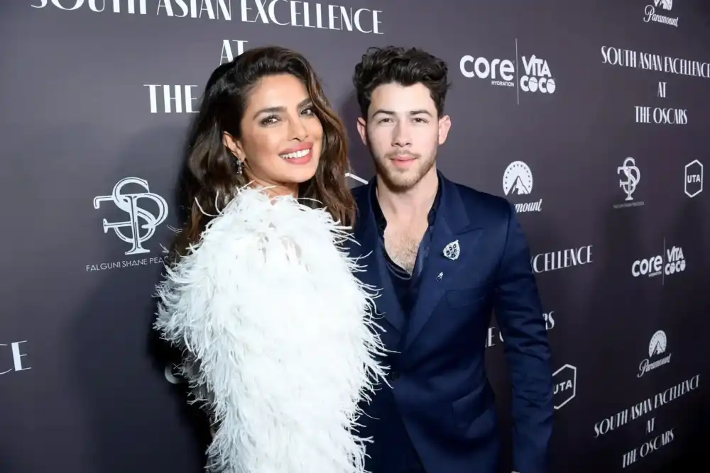 Elegant couple at a red carpet event.
